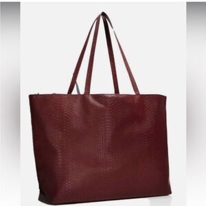 Elegant Burgundy Tote Bag from bloomingdales. The actual brand is Bloomingdales.